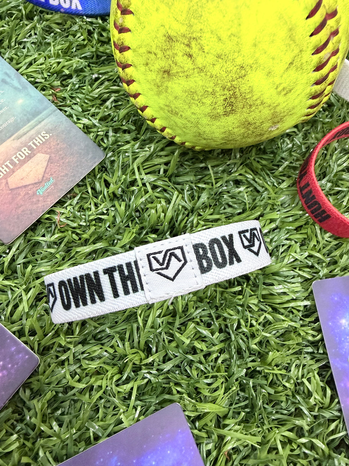 Own the Box. Own Your Pitch.™ TAP Band | White Message Confidence Wristband for Softball & Baseball